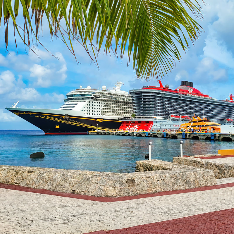 Disney Cruise Line, and Virgin Voyages Scarlet Lady in Port in Cozumel Mexico