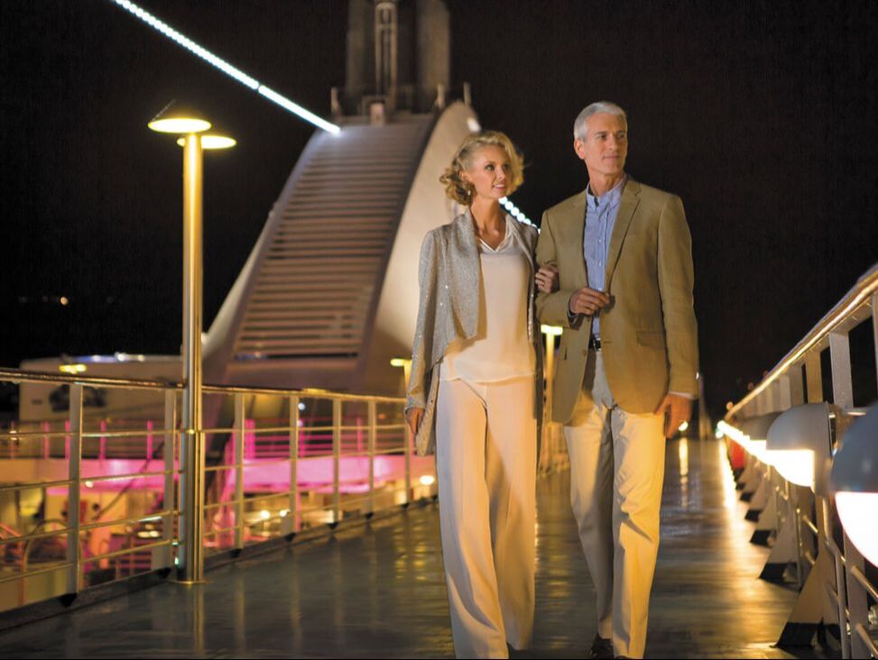 Regent Seven Seas Cruise ship couple walking the deck